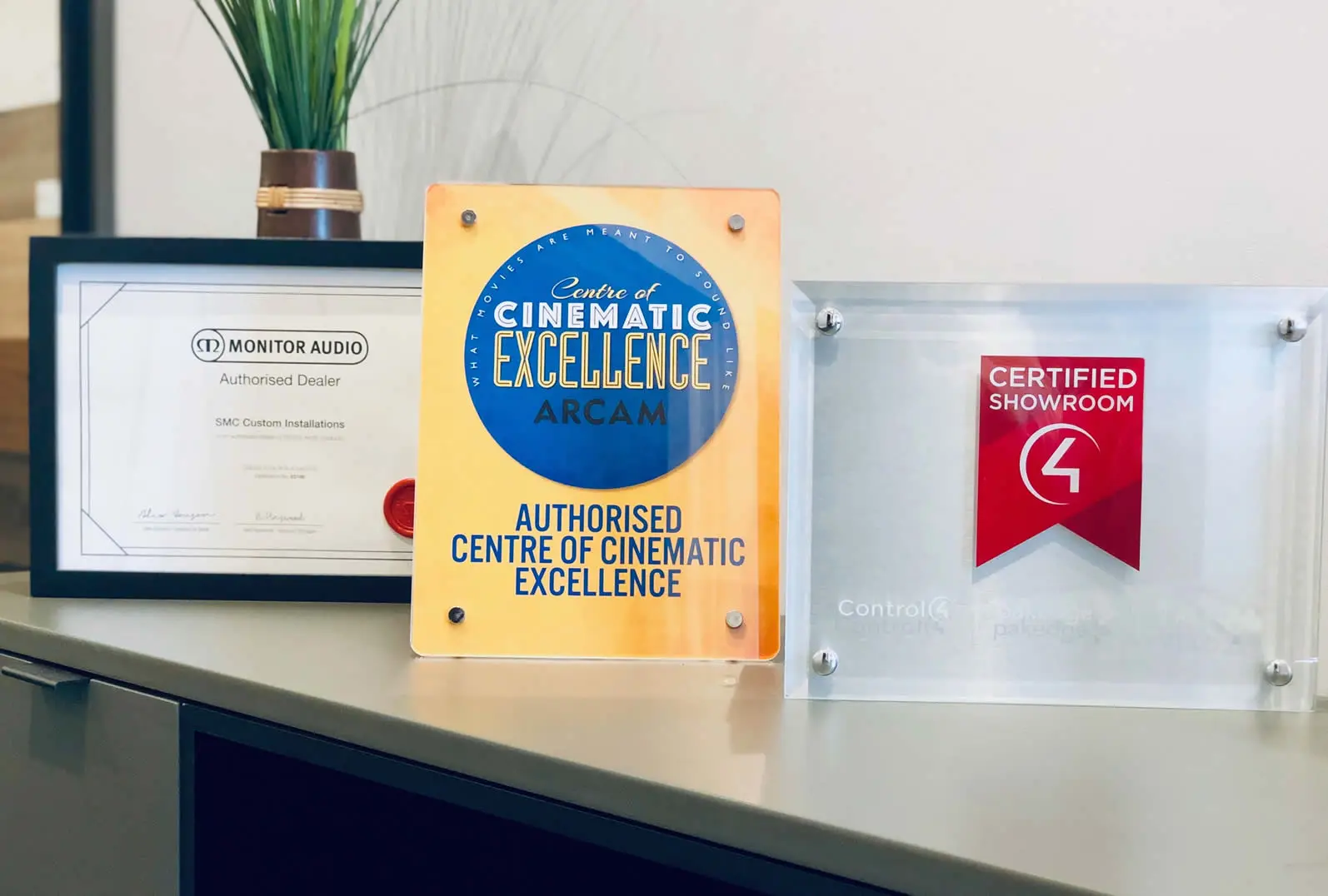 Control4 Certified Showroom and Arcam Centre of Cinematic Excellence plaques at SMC Custom Installs