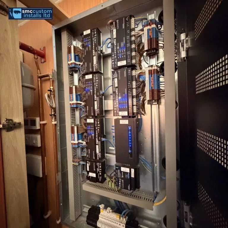 Lutron lighting control panel with processors and wiring inside a plant room enclosure