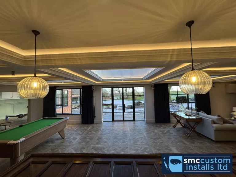 Games room with pool table, pendant lights and LED-lit coffered ceiling with roof lantern