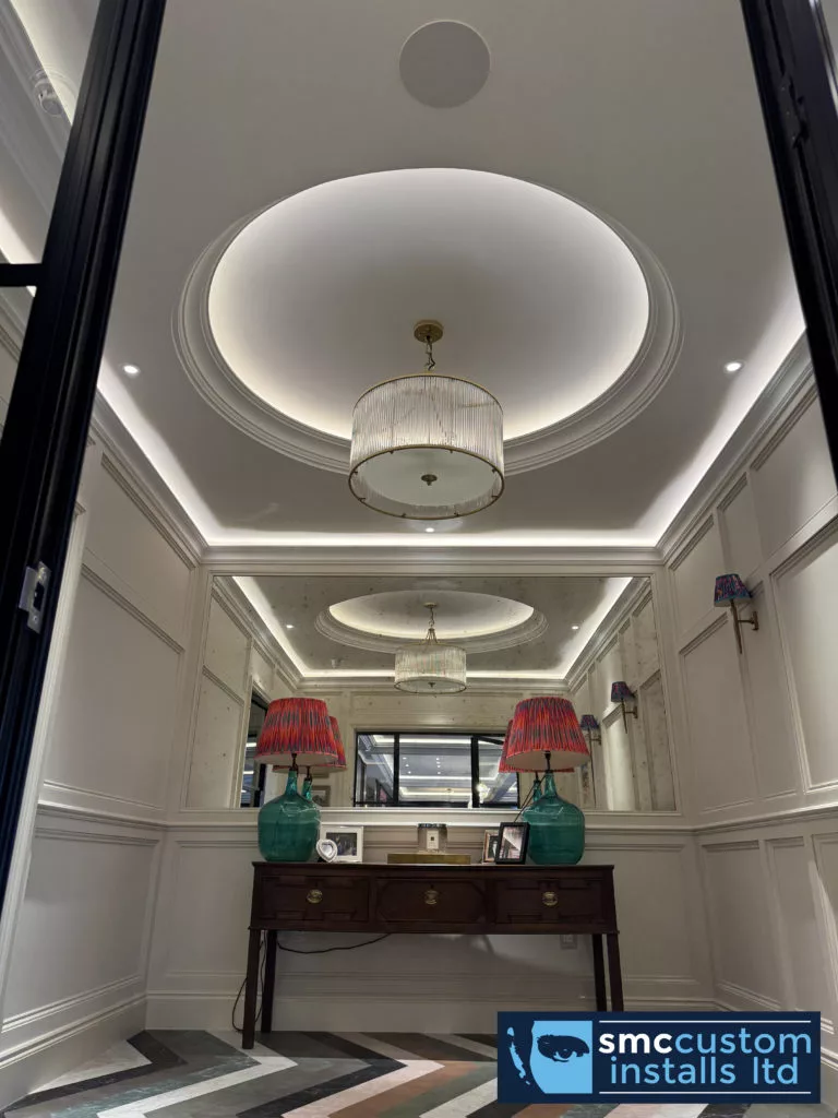 Entrance hall with circular ceiling coffers, concealed LED lighting and an in-ceiling speaker