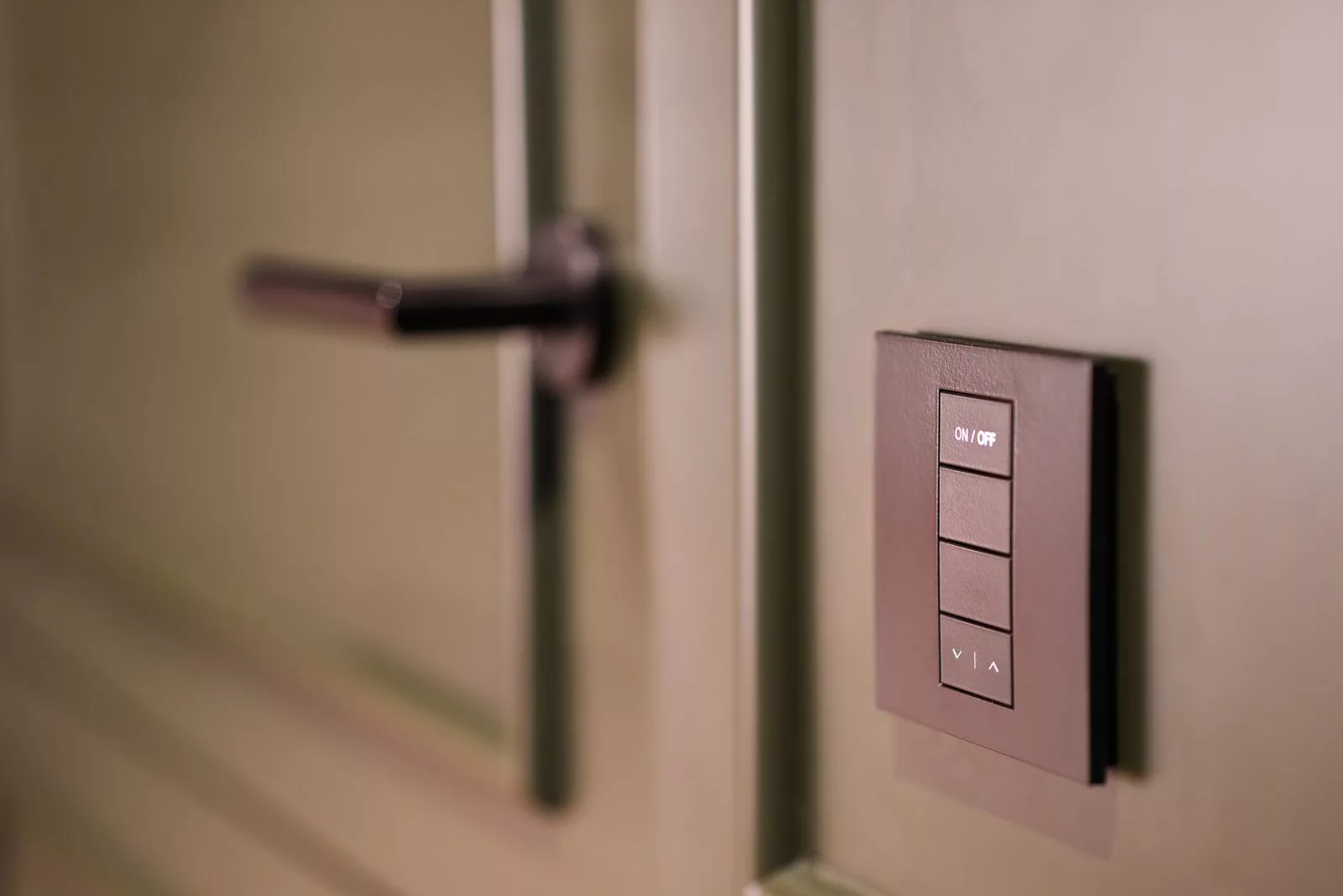 Smart lighting keypad beside a door in a period home